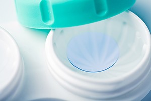 blue contact lens in white container